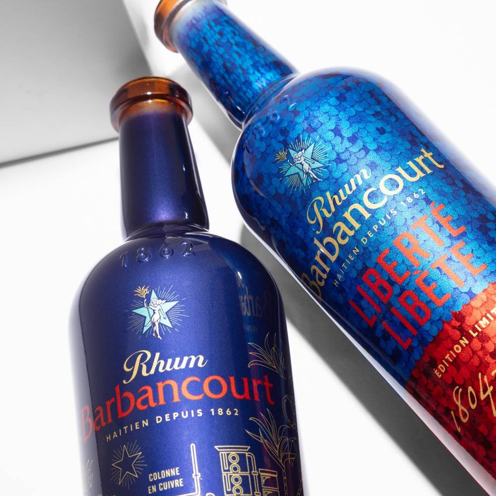 Two Rhum Barbancourt limited-edition bottles decorated by sublimation, base to neck