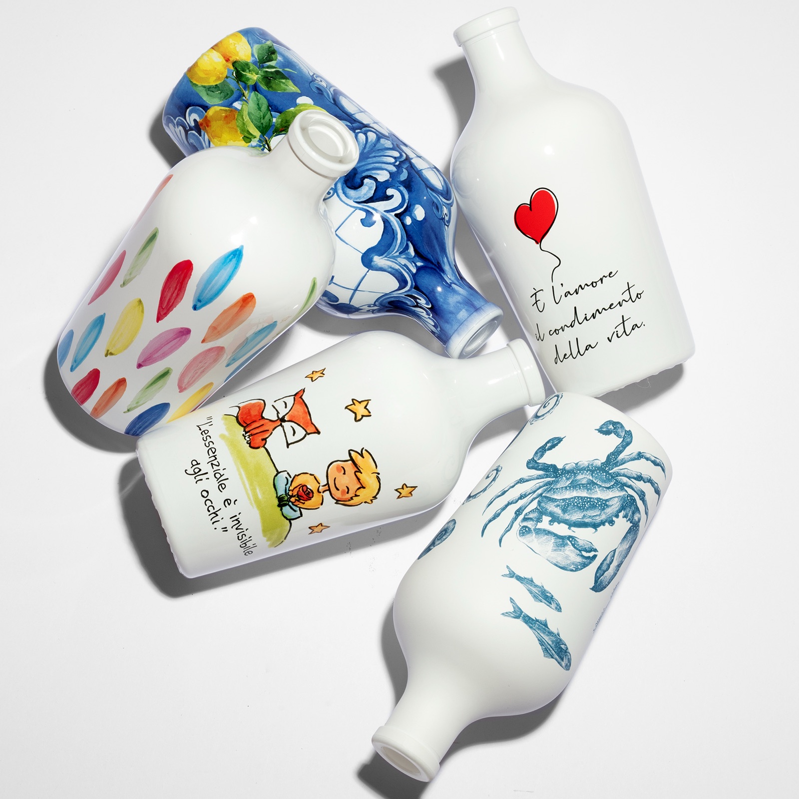 Frantoio Paparella olive oil bottles — five hand-painted designs reinvented on glass by ATIU