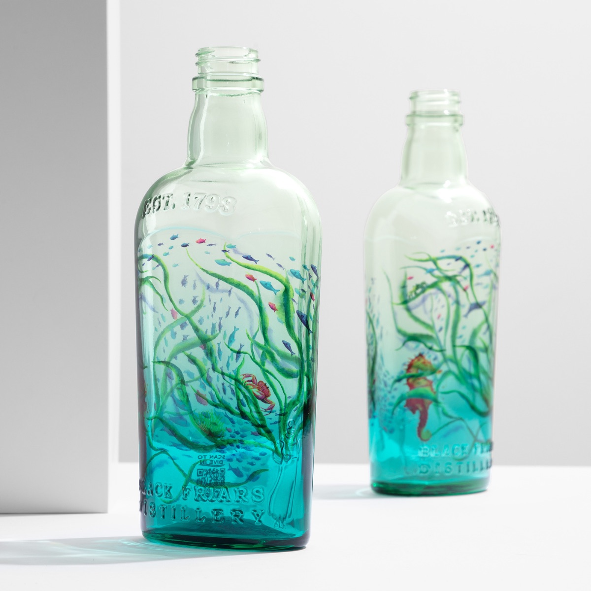 Sea-life artwork on clear primer, the glass in view