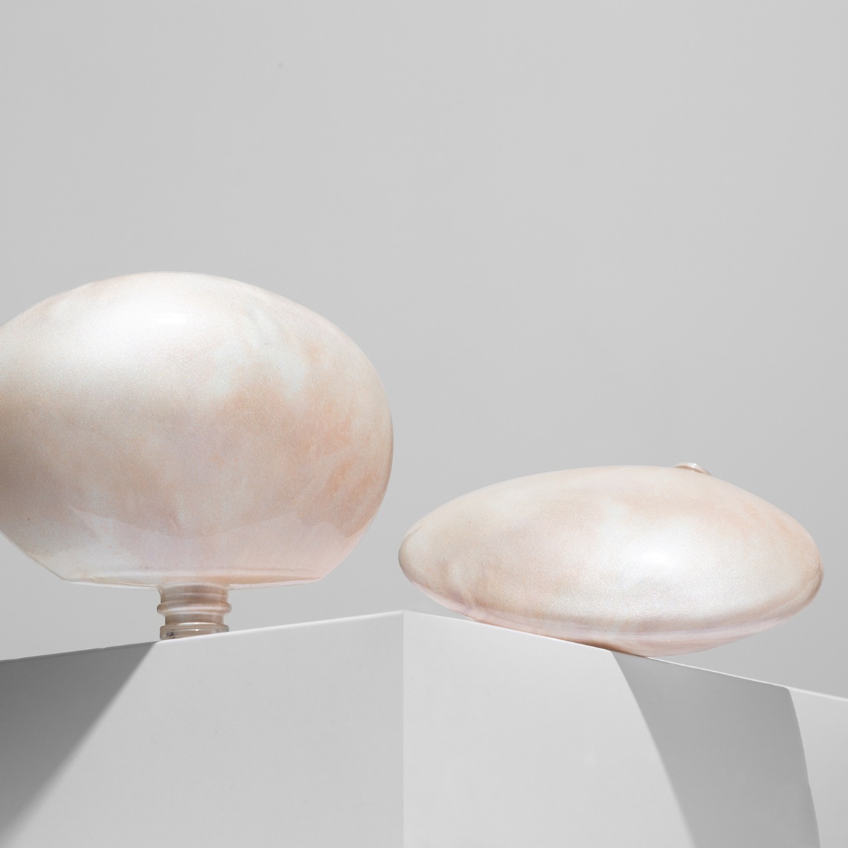 Pearl primer on sculptural flacons